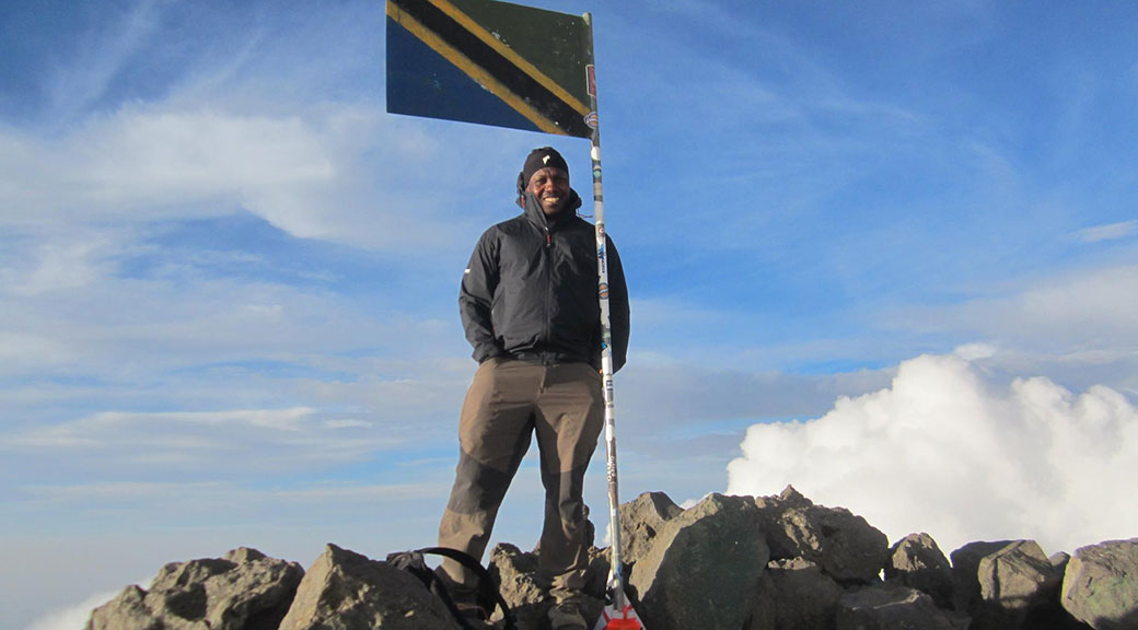 Godson Kastai at the peak of Mt Meru